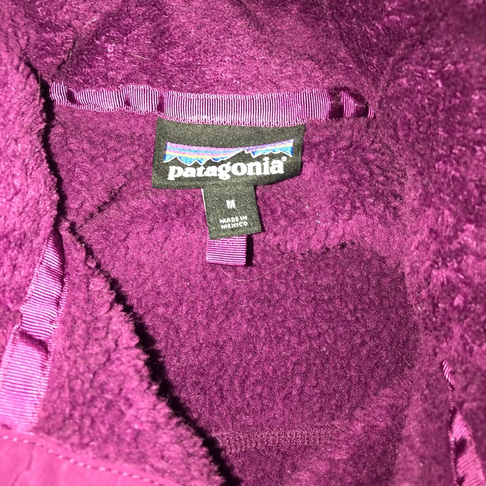 Buttoned quarter zipped Patagonia.